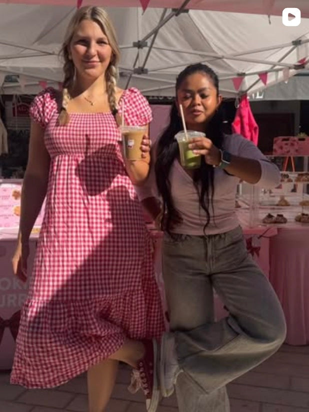 Tayler and a friend at the stall